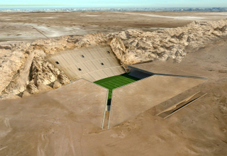 Illustration for article titled Awesome Desert Stadium Built Right Into the Ground